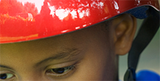 Safe and Healthy Me - Safety - Boy wearing bright red helmet.