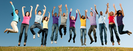 Colorful group of diverse kids jumping for joy!