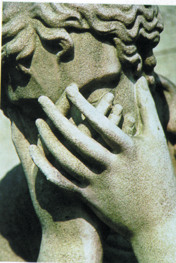 Statue with hands covering face