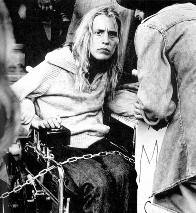 Blonde Woman Chained to Wheelchair