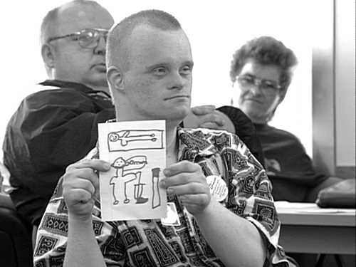 Phot of man holding hand drawn cartoon