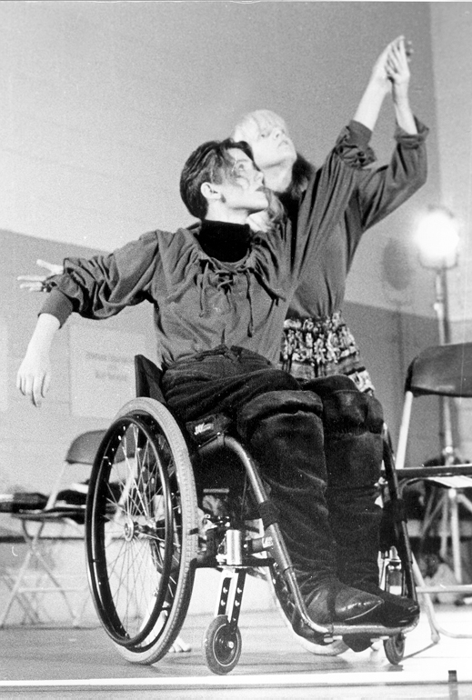Photo of two dancers with one in wheelchair
