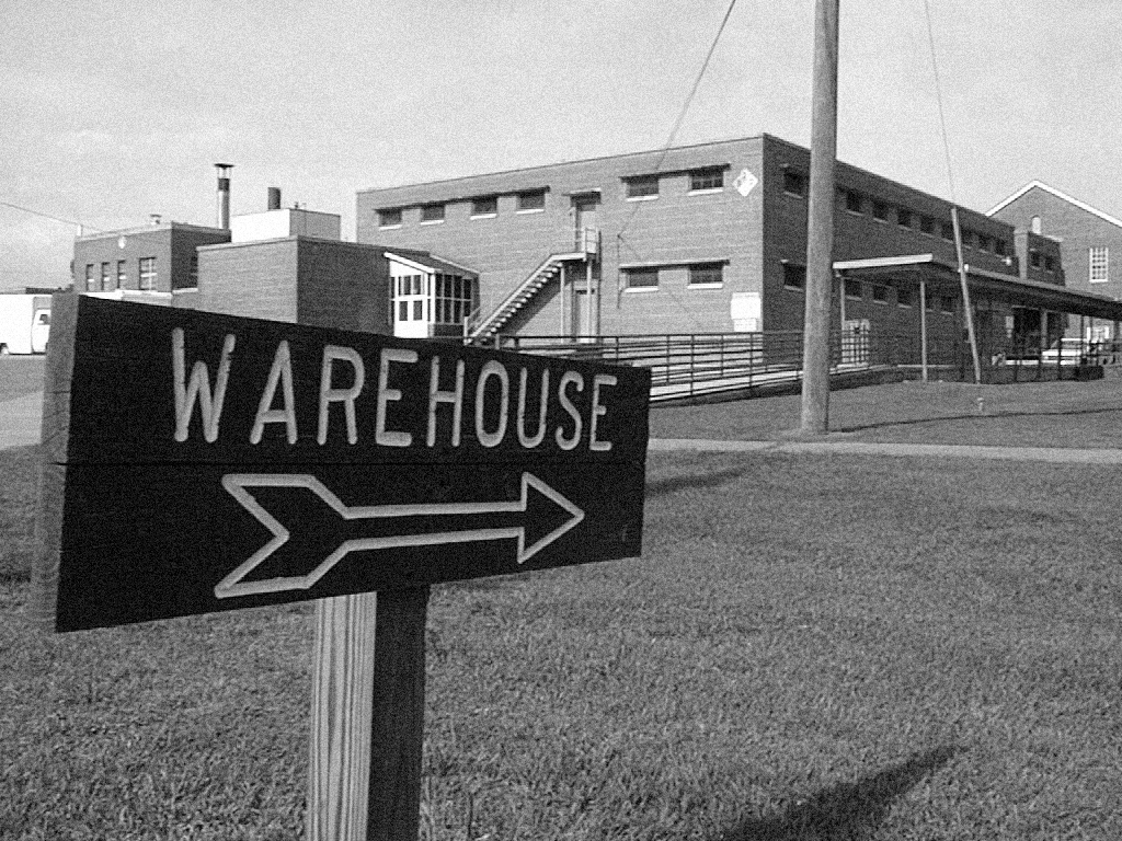 Sign pointing to warehouse