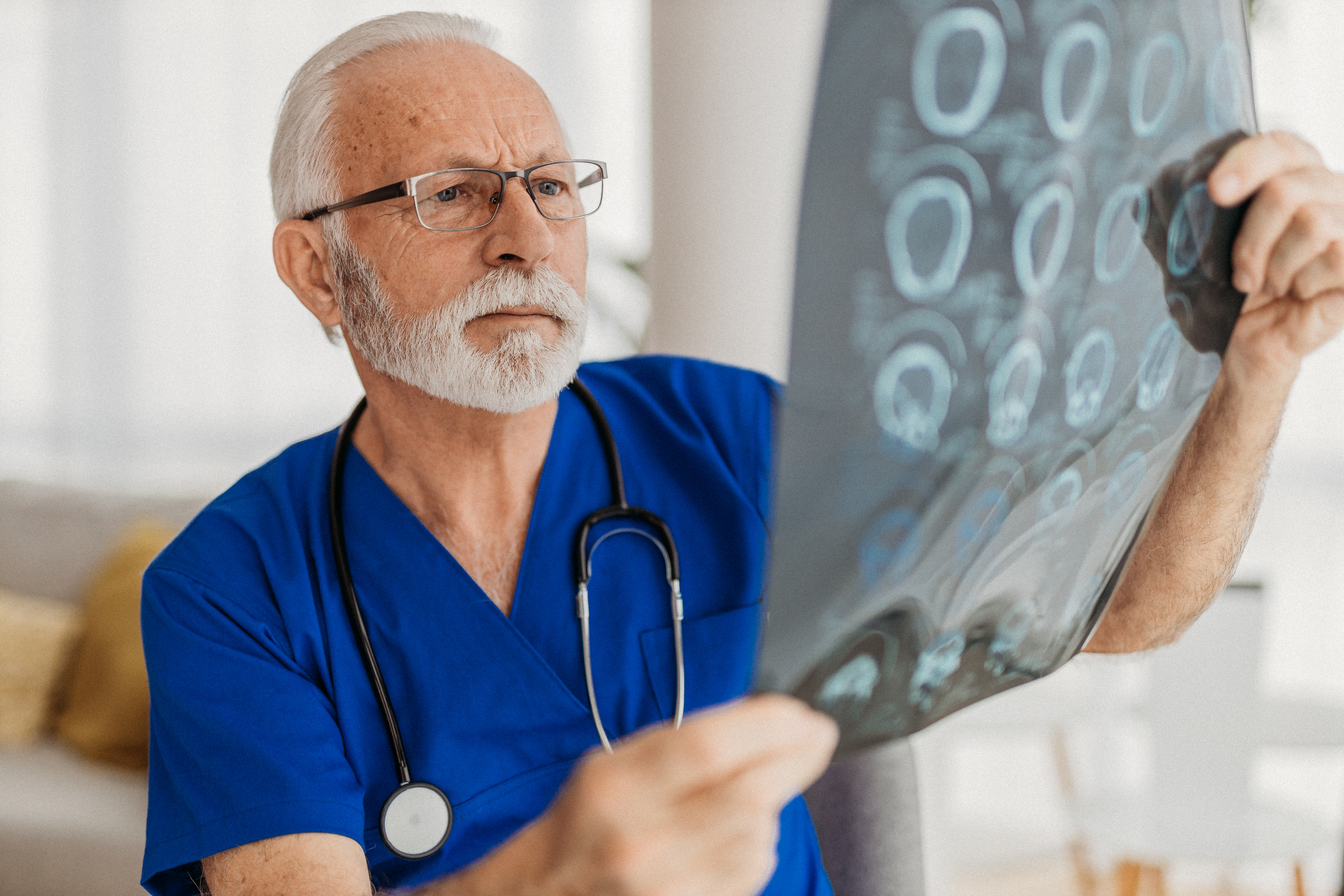 A doctor examining an xray
